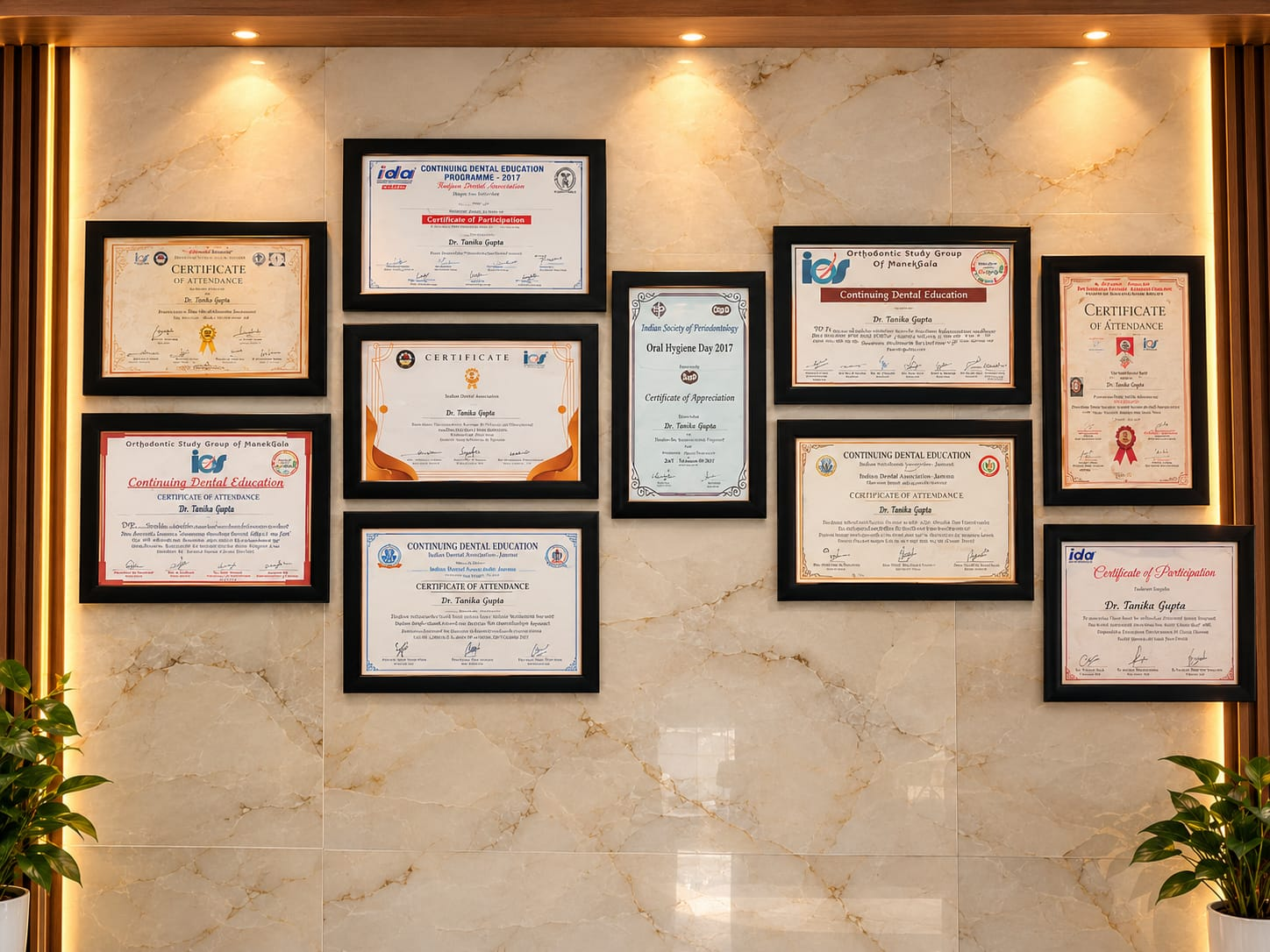 Framed dental and orthodontic certificates displayed at Smile Suite Dental Clinic